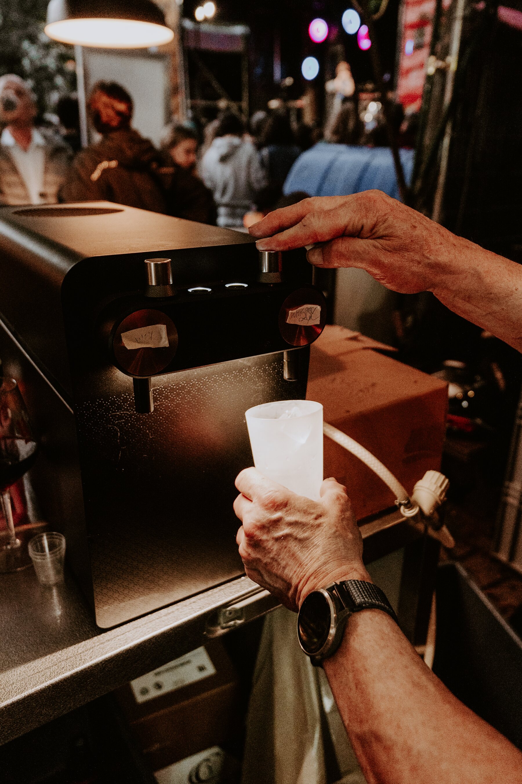 Curiozity serving cocktails at a live event